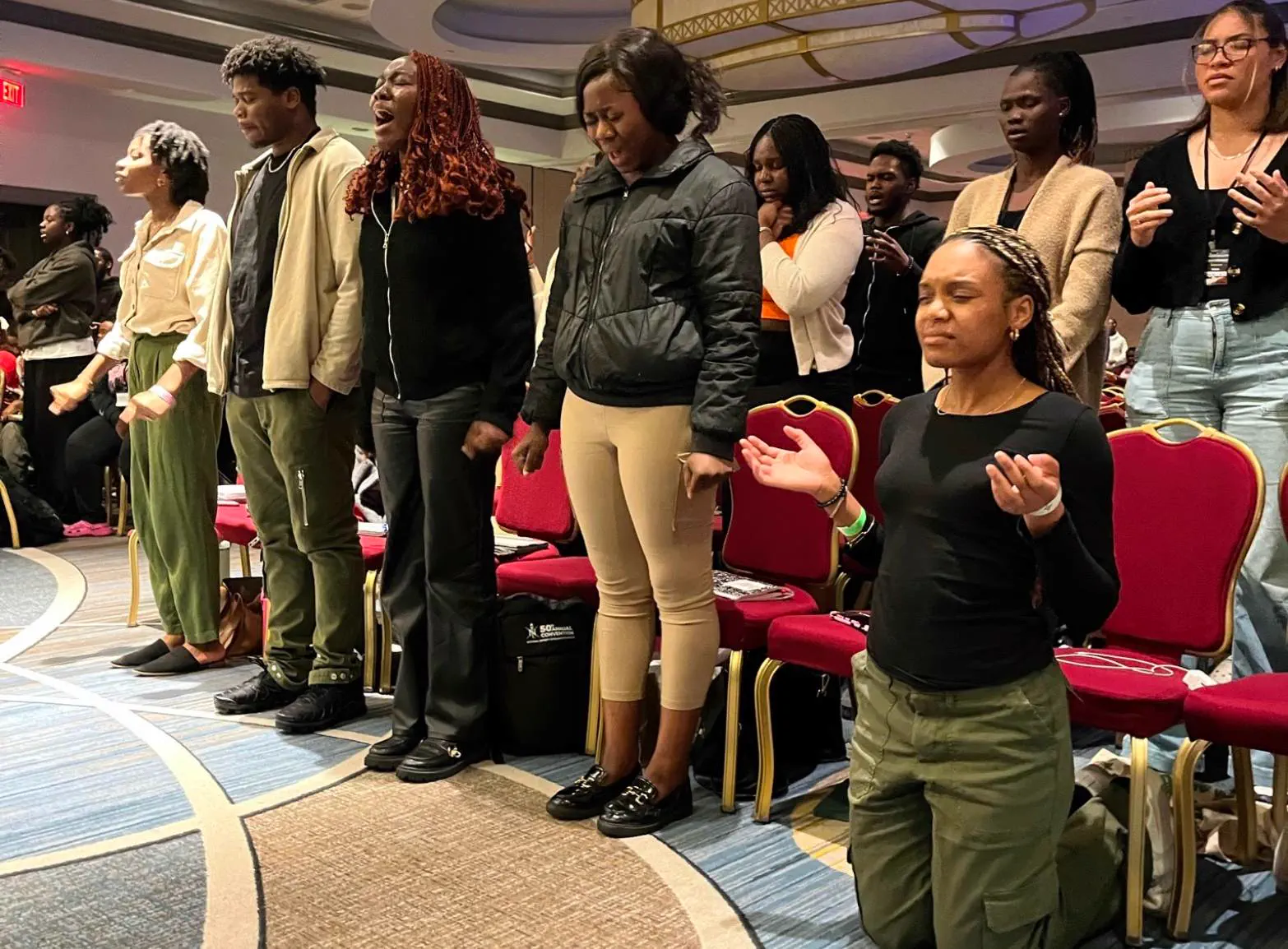 Students standing together after a 100% Triumph gathering.