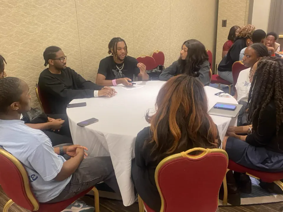 Students working together at an academic session.