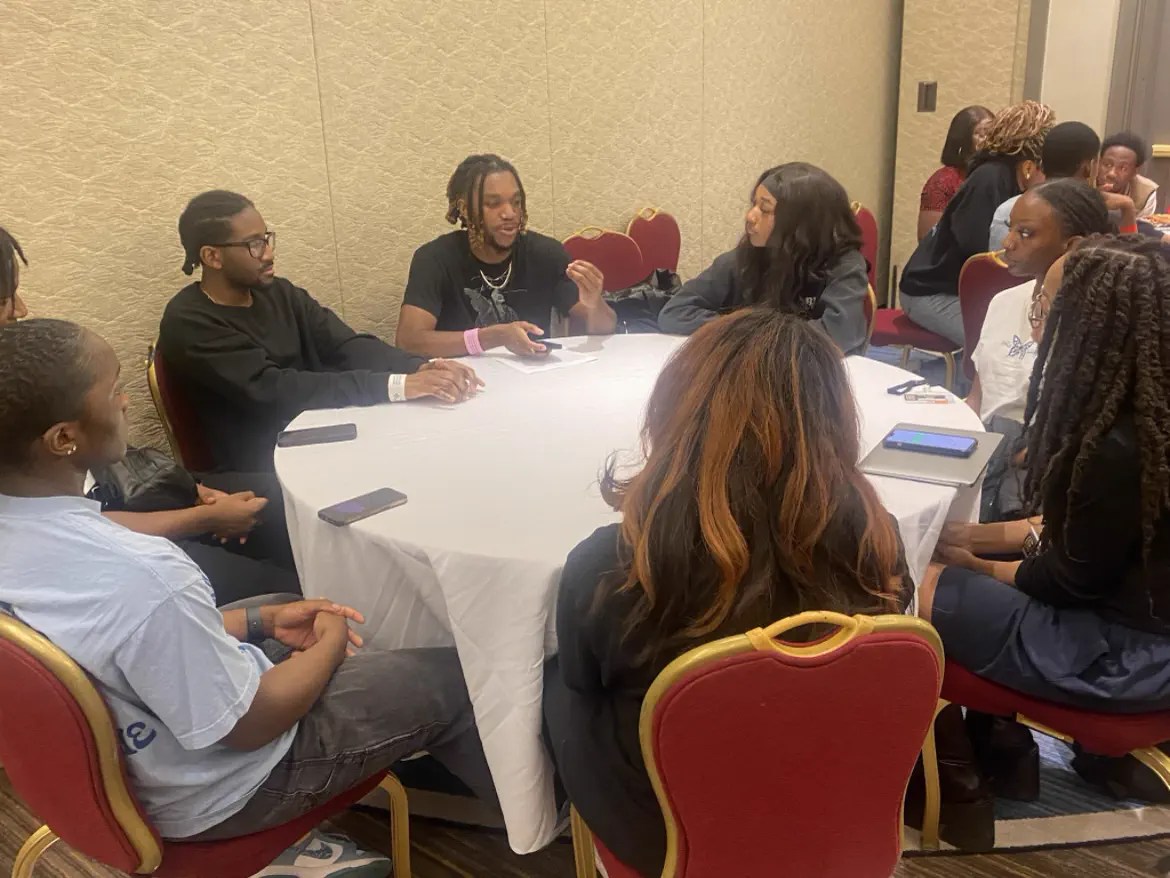 Students working together at an academic session.